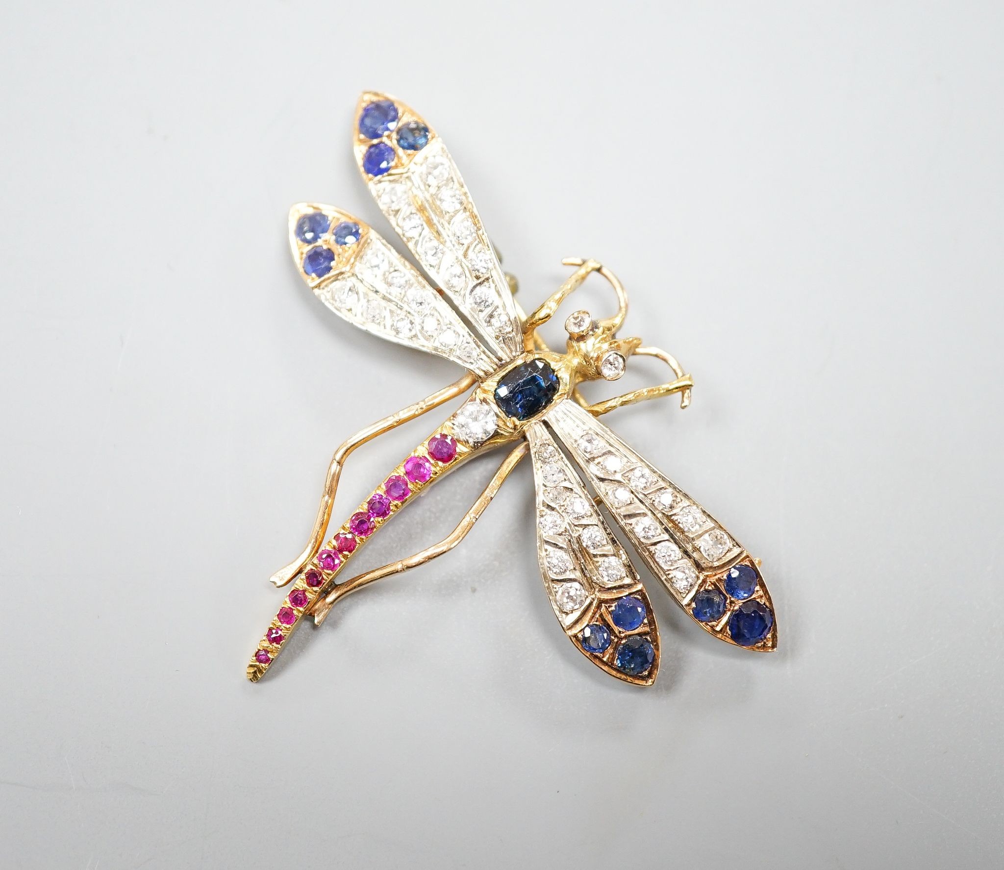 A Victorian style 14k, ruby, sapphire and diamond set dragonfly brooch, 47mm, gross weight 18.5 grams.